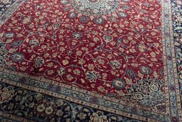 Close-up detail of 2000s Mashad rug from Iran / Persia showing Wool weave