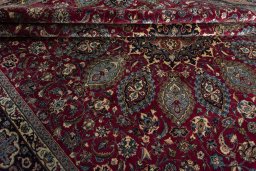 Close-up detail of 2000s Mashad rug from Iran / Persia showing Wool weave