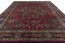 Surface texture of 2000s Mashad rug with natural Wool and intricate pattern