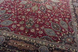 Close-up detail of 2000s Mashad rug from Iran / Persia showing Wool weave