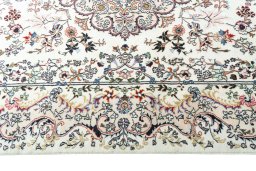 Corner detail of New Mashad rug showing border pattern and Wool pile