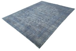 Corner detail of 1950s Mashad rug showing border pattern and Wool pile