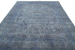 Surface texture of 1950s Mashad rug with natural Wool and intricate pattern