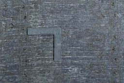 Surface texture of 1950s Mashad rug with natural Wool and intricate pattern