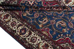 Close-up detail of 2000s Mashad rug from Iran / Persia showing Wool weave