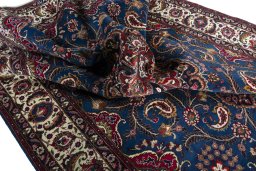 Surface texture of 2000s Mashad rug with natural Wool and intricate pattern