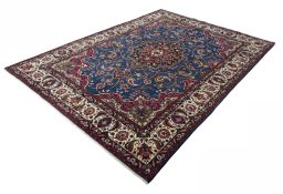 Corner detail of 2000s Mashad rug showing border pattern and Wool pile