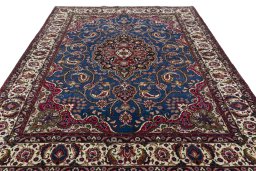 Surface texture of 2000s Mashad rug with natural Wool and intricate pattern