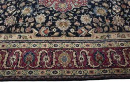 Corner detail of 1970s Mashad rug showing border pattern and Wool pile