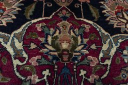 Close-up detail of 1970s Mashad rug from Iran / Persia showing Wool weave