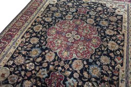 Backside of handmade 1970s Mashad rug showing knot structure and weave density