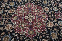 Central medallion detail of 1970s Mashad rug from Iran / Persia