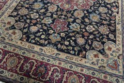 Close-up detail of 1970s Mashad rug from Iran / Persia showing Wool weave