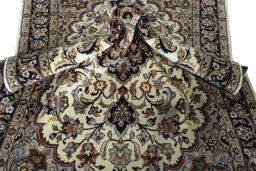 Surface texture of 2000s Mashad rug with natural Wool and intricate pattern