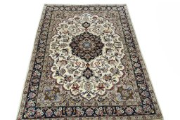 Surface texture of 2000s Mashad rug with natural Wool and intricate pattern