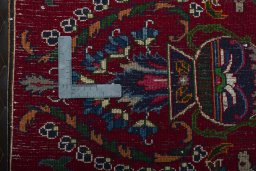 Backside of handmade 2000s Mashad rug showing knot structure and weave density