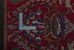Backside of handmade 2000s Mashad rug showing knot structure and weave density
