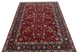 Surface texture of 2000s Mashad rug with natural Wool and intricate pattern