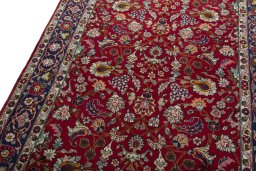 Backside of handmade 2000s Mashad rug showing knot structure and weave density