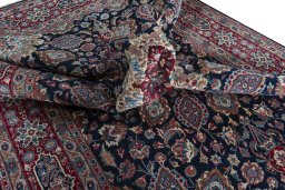 Surface texture of 1970s Mashad rug with natural Wool and intricate pattern