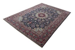 Corner detail of 1970s Mashad rug showing border pattern and Wool pile