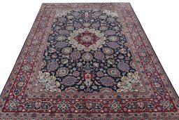 Surface texture of 1970s Mashad rug with natural Wool and intricate pattern