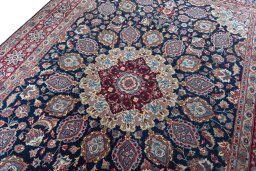 Backside of handmade 1970s Mashad rug showing knot structure and weave density