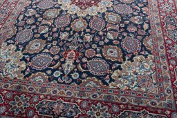 Close-up detail of 1970s Mashad rug from Iran / Persia showing Wool weave
