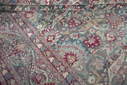 Close-up detail of 1950s Mashad rug from Iran / Persia showing Wool weave