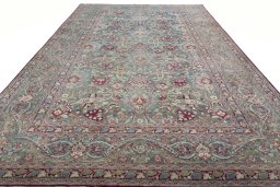 Surface texture of 1950s Mashad rug with natural Wool and intricate pattern