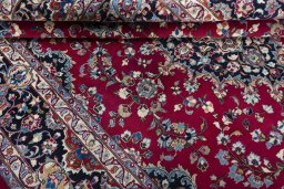 Close-up detail of 2000s Mashad rug from Iran / Persia showing Wool weave