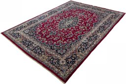 Corner detail of 2000s Mashad rug showing border pattern and Wool pile