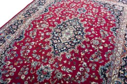 Backside of handmade 2000s Mashad rug showing knot structure and weave density