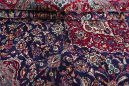 Close-up detail of 2000s Mashad rug from Iran / Persia showing Wool weave