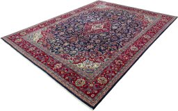 Corner detail of 2000s Mashad rug showing border pattern and Wool pile