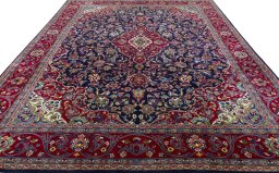 Surface texture of 2000s Mashad rug with natural Wool and intricate pattern