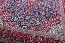 Close-up detail of 2000s Mashad rug from Iran / Persia showing Wool weave