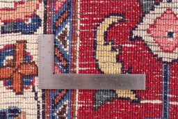 Backside of handmade 1990s Mashad rug showing knot structure and weave density
