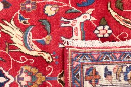 Close-up detail of 1990s Mashad rug from Iran / Persia showing Wool weave