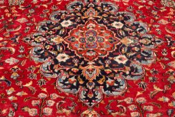 Corner detail of 2000s Mashad rug showing border pattern and Wool pile