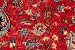 Close-up detail of 2000s Mashad rug from Iran / Persia showing Wool weave