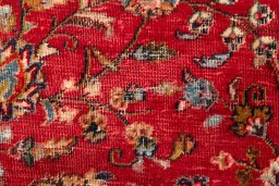 Surface texture of 2000s Mashad rug with natural Wool and intricate pattern