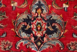 Backside of handmade 2000s Mashad rug showing knot structure and weave density