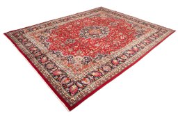Corner detail of 2000s Mashad rug showing border pattern and Wool pile