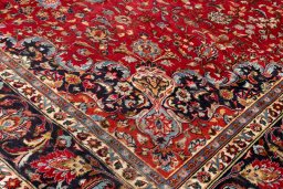 Backside of handmade 2000s Mashad rug showing knot structure and weave density
