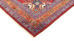 Backside of handmade 2000s Mashad rug showing knot structure and weave density