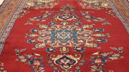 Close-up detail of 2000s Mashad rug from Iran / Persia showing Wool weave