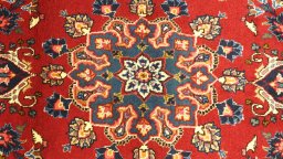 Full view of 2000s Mashad rug from Iran / Persia, 235 × 115 cm in Red tones