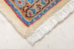 Backside of handmade New Moud rug showing knot structure and weave density