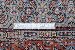 Backside of handmade New Moud rug showing knot structure and weave density